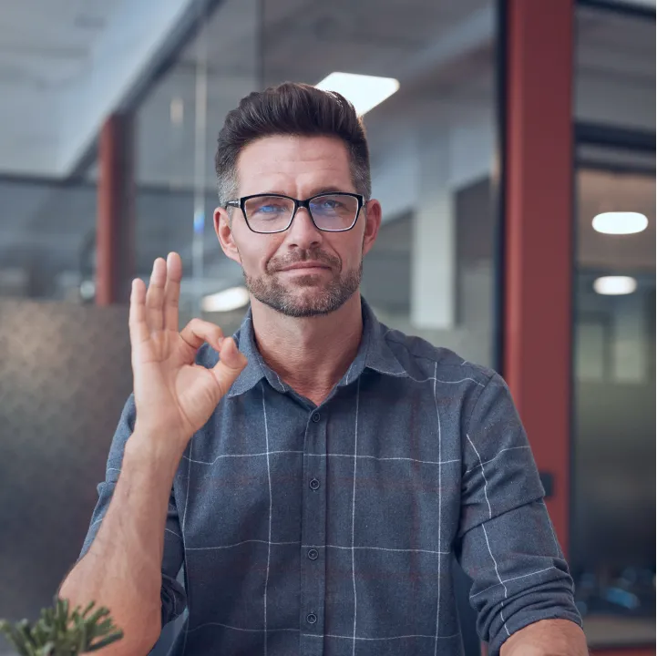 A user showing a perfect hand sign